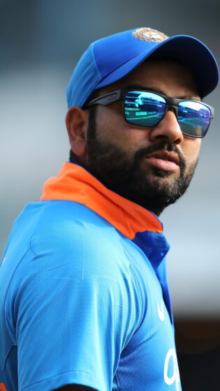 rohit sharma wallpaper is wearing glasses 1944x3456