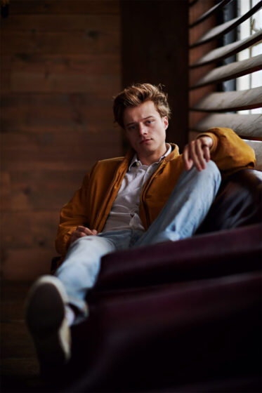 jj outer banks wallpaper as he sits in the dark 833x1250