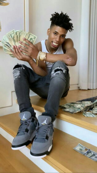 nle choppa wallpaper holding a lot of money in hand 850x1511