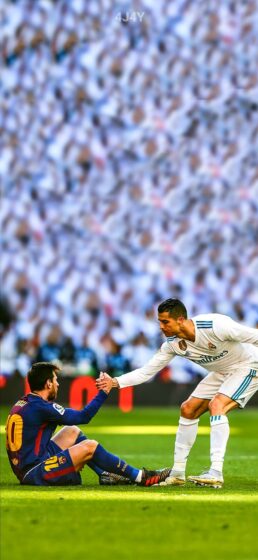 Ronaldo and Messi wallpaper on the field 945x2048
